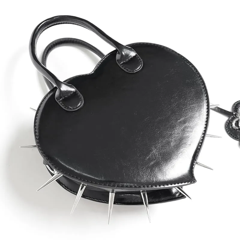 Schwarze gotische Damenhandtasche mit Pentagramm, Stacheln und herzförmigem Muster