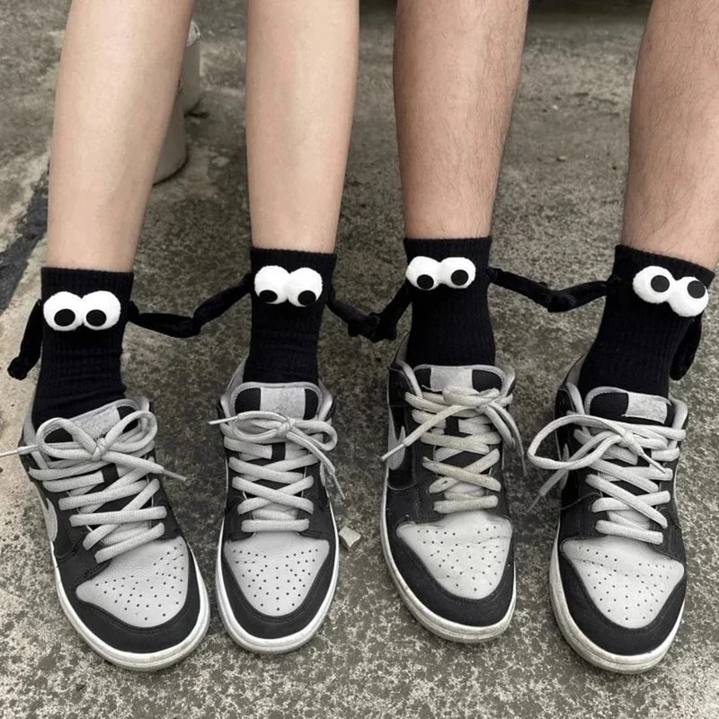 Magnetische Socken, Die Die Hand Halten