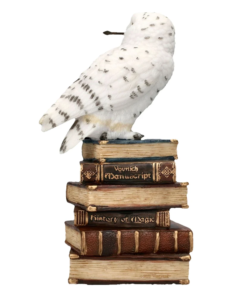 Schneeeule auf Zauberbücher sitzend 14cm