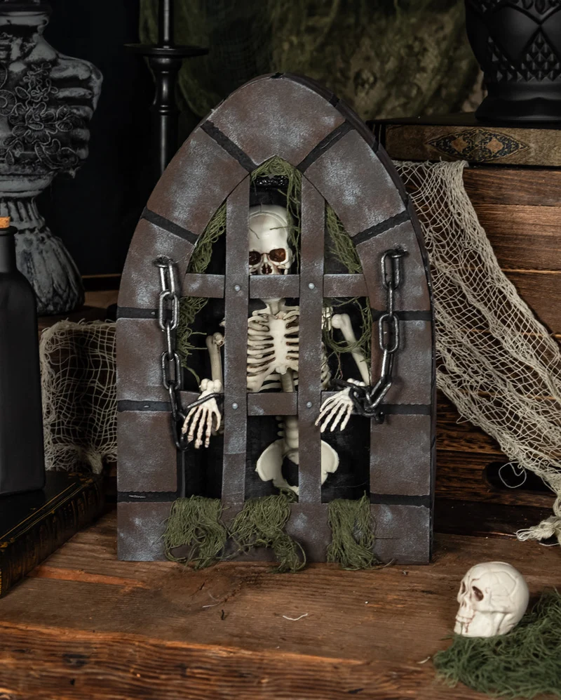 Gefängnis mit Skelett Animatronic 31cm