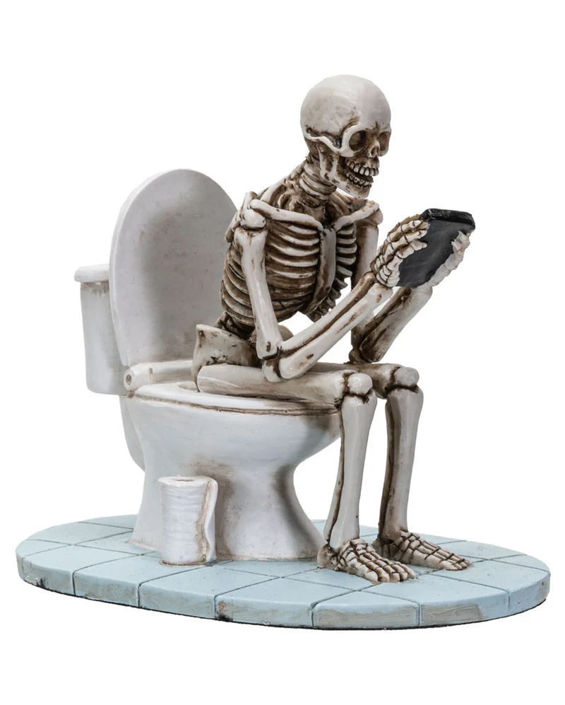 Skelett auf der Toilettenschüssel